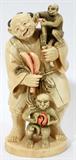 Lot #13, CHINESE CARVED IVORY FIGURE HOLDING MONKEYS