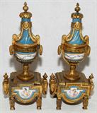 Lot #2359, FRENCH PORCELAIN AND GILT SPELTER CHENETS, 19TH C., PAIR, H 14", DIA 6"