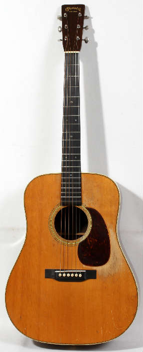 Lot #1, VINTAGE 1937 MARTIN, D-28, ACOUSTIC GUITAR,  SERIAL #65574, 14 FRET, 1937, having 14 frets mounted on a mother-of- pearl snowflake inlay fret board; solid peghead with original Grover tuning keys and gilt inscription: "C.F. Martin Co. 1833" across top; ivory imbedded herringbone accents on an Adirondack spruce top with "comma shape" pickguard; Brazilian rosewood back and sides with "zipper" back stripe and ivroid body binding; ivory string pegs and bridge. This guitar was purchased by the consigners father in 1942.