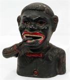 lot #75 BLACK AMERICANA CAST IRON BANK, H 8"