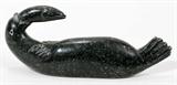 Lot#2208, INUIT CARVED SOAPSTONE SEAL WITH FISH, H 3 1/2", L 7 3/4"