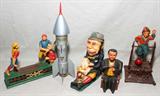 Lot#357, THE BOOK OF KNOWLEDGE MECHANICAL BANKS (4) & A ROCKET STILL BANK, H 6"-13"
