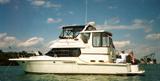Lot#2044, Model 404 Cockpit MY, Manufactured in 1999, Beam 13' 3"; Draft 3' 3"; Weight 24,300#, Hull type: fiberglass; MercCruiser engine, 7.4 MPI (2); Engine year: New in 2009-not yet broken in., Engine hours: 185; Horsepower: 2 X 330 hp; Cruising Speed: 17 knots; Maximum speed: 26 knots; Holding: 72 gal.; Water: 70 gal.; Fuel capacity: 318 gal., Fuel type: Gas; Trailer: No.