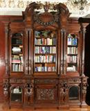 Lot#2216, RENAISSANCE REVIVAL CARVED WALNUT BOOKCASE, 19TH CENTURY, H 11' 7", W 9' 8", D 31 1/2"