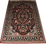 LOT#8  SILK AND WOOL CHINESE RUG, MODERN, 4' X 6", Having a red ground and featuring a central floral medallion with overall multi-colored floral design.  Nice fringe.