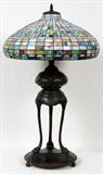 LOT#33  BRONZE LEADED GLASS LAMP, MODERN, H 44", DIA 19", Shell design leaded glass shade, bronze lamp body with three contoured supports ending with paw feet mounted on an integral round base having beaded edge; all supported on ball feet.