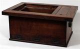 LOT#46  JAPANESE ELMWOOD HIBACHI, EARLY 20TH C, H 12", W 24", D 18", having a copper lined fire pit inset into a rectangular top with a small side compartment with wood slat lid. Box joints at the corners of the sides with three small drawers mounted with wrought iron pulls and handles on the sides.