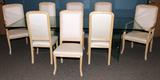 LOT#120  BEVELED GLASS DINING TABLE & CHAIRS, NINE, Beveled glass table having glass tripod base pedestals with brass retainer clips, L 108", W 45".  Eight chairs, two arm and six side chairs.  Blonde wood & peach upholstery.