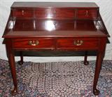 LOT#127  ENGLISH MAHOGANY DESK, 19TH C., H 35", W 41", D 30", The stepped back fitted with three drawers, two drawers in the frieze, raised on round tapering legs with pad feet.