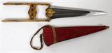 LOT#188  EAST INDIAN PRINCE'S KATAR, DAMASCUS AND GOLD DAMASCENE 18TH C., L 8 1/2" BLADE, small prince size Katar (Indian push dagger), having a 8 1/2", hand polished patterned Damascus double edged blade with armor piercing reinforced tip. Elaborately engraved gold damascene hilt and ricasso. Red cloth covered wood sheath.