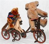 LOT#234  WROUGHT IRON TRICYCLES AND TEDDY BEARS 4 PCS., includes antique wrought iron and wood tricycle, with metal spoke wood wheels, 15" H. x 16" L. with a light brown 'Bears By Jo' teddy bear, 16" L. also one horse and buggy form antique tricycle with wrought iron frame, metal spoke wood wheels along with a Herrington Collegiate Collectables teddy bear with University of Michigan jersey, 11" H., 4 pcs. Total.