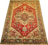 LOT#259  INDO - SERAPI, WOOL RUG, 6' 1" X 9' 1", having an orange ground, beige corner brackets, large central geometric medallion all with geometric floral designs; one wide border flanked by two narrow borders also with floral designs.