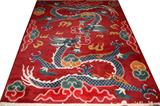 LOT#261  TIBET WOOL HAND WOVEN RUG 8'3" X 6'8", red field, dragon motif. Hand woven.