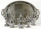 LOT#1001  GORHAM 'MAINTENON' STERLING TEA & COFFEE SET WITH TRAY, 1919, SEVEN PIECES, L 29", Sterling silver set includes 1 teapot, H.10", 1 coffee pot, H.11 1/2", 1 creamer, 1 covered sugar bowl, 1 waste bowl, 1 hot water kettle on stand, H.13 1/2", and 1 oval waiter tray, L.29" to the handles.  All are engraved with a three-letter script monogram, "LHB" (hollowware one side only), are stamped with the Gorham mark, date mark for 1919 (except tray), and numbers A 10201-10207/1.  Totaling approximately 315.4 troy oz.
