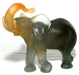 LOT#1014  DAUM PATE DE VERRE ELEPHANT, H 7 3/4", L 9", Shaded gray body, orange trunk and ear; signed "Daum France" at one foot.