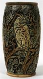 LOT#1022  WELLER KNIFEWOOD POTTERY VASE WITH HOODED OWLS, EARLY 20TH C., H 8.5", Ovoid shape, carved with hooded owls in a tree under a crescent moon, glazed green and brown, impressed "Weller" at the underside