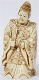 LOT#1056  JAPANESE CARVED IVORY OKIMONO OF A MAN, SIGNED, H 5", Intricately carved on all sides.