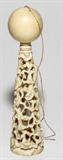 LOT#1293  CARVED IVORY GAME, H 5", Consisting of a carved ivory sphere and a pierced ivory tower with floral motifs.  No apparent marking.