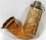 LOT#1404  MEERSCHAUM PIPE BOWL CARVED WITH FIGURAL SCENE, 19TH C., L 5", Carved in low relief with a standing man whose arm is in a sling, a crouching man, and another man holding a sword and a woman in his arms, Gothic arches about.  Mounts are not marked.  Measures L.5" x 4".