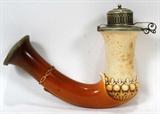 LOT#1405  CARVED MEERSCHAUM PIPE BOWL, 19TH C., L 5", The bowl carved in low relief with a stylized leaf and berry motif, a chain pattern at the neck, the metal rim is stamped twice "JH/NS" enclosed (unidentified, see photo).  Measures L.5" x 7 1/4".