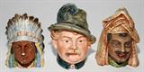 LOT#1408  AUSTRIAN PORCELAIN TOBACCO JARS, C. 1890, THREE, H 6", Including 1 figure of a German man in phumed hat, 1 of an American Indian Chief, and 1 of a Middle Eastern Arab.