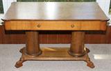 LOT#1466  EMPIRE STYLE OAK PARLOR TABLE, H 29", W 37", D 27", Having a single drawer, columnar for supports, a lower shelf/stretcher, and 4 paw feet.