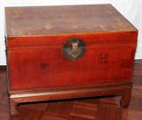 LOT#1494  CHINESE MING STYLE RED LEATHER SMALL CHEST, SEMI-ANTIQUE, H 21", W 20", L 29", Iron bail side handles.