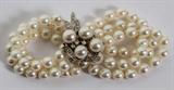 LOT#2064  PEARL 3 STRAND & DIAMOND BRACELET, Estate of John Mayes, Bloomfield Hills.  4 pearls in 14kt clasp; 18 diamonds; 78 pearls; set in white gold