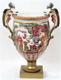 LOT#2156  CAPO DI MONTE PORCELAIN URN, 19TH CENTURY, H 24", W 18", Classical style urn flanked by male figural handles with wings, depicting the myth of Diana and Endymion, and another on the reverse, decorated in shades of bright yellow, fuchsia, spring green, and brown, raised on a square d'ore bronze plinth.