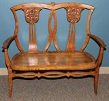 LOT#2059  CARVED OAK BENCH, LATE 19TH C., L 43", Saddle seat; carved flowers in pierced splat back.
