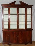 LOT#2195  ANTIQUE GEORGIAN FIGURED MAHOGANY BREAKFRONT, 19TH C., H 103 1/2", W 69", D 14", Four glass doors atop four doors all ending on bracket feet.  Possibly early 19th c.  Original glass.