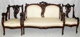 LOT#2198  ENGLISH MAHOGANY SALON SUITE, THREE PIECES, 19TH CENTURY, Including a settee, L 37" x 53", all with deeply carved foliate crest with an open back, double cushioned back, scrolled arms with trellis style supports, striped silk upholstery in white and gold with flowers, with a matching arm and side chair.