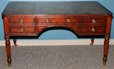 LOT#2262  ENGLISH STYLE OAK WRITING DESK, H 31", L 58", D 32", Having a tooled green leather top, five drawers, reeded legs and brass casters.