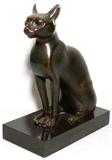 LOT#2348  20TH C. BRONZE SITTING CAT AFTER THE EGYPTIAN, H 11", D 8 1/2", W 4 1/2", Has gilt loose earrings; unsigned; black marble base.