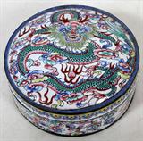 LOT#2397  CHINESE ENAMEL COVERED ROUND BOX, ANTIQUE, H 2 1/4", DIA 5", Dragon, bat and floral motifs against white.