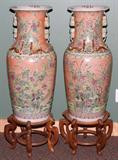 LOT#2409  CHINESE PORCELAIN VASES, PAIR, H 37", DIA 13 1/4", Colors of peach, green, blue, rose & yellow.  Flower, leaf and butterfly design with gold salamander designs.  Oriental wood bases.