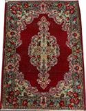 LOT#2454  PERSIAN KERMAN HAND WOVEN WOOL RUG, CIRCA 1930 3' 0" X 2' 0", Red ground, central medallion, and floral border. Shows wear.