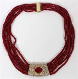 Lot# 22 8.00CT RUBY & 5.40CT DIAMOND NECKLACE WITH 7 STRANDS OF RUBY BEADS, 248CT, 14kt yellow gold. 78.5 grams. Center ruby is enhanced and ruby strands are heat enhanced.