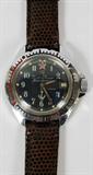 Lot# 31 RUSSIAN SUBMARINE COMMANDER WATCH, #780785, With replaced band. Black face. Profile of a Russian submarine, red star @ 12:00; anchor at 6:00; stainless steel case. 17 jewels, waterproof. Stamped on back plate #780785, Made in USSR.