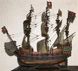 Lot# 35 WOOD FOUR-MASTED ENGLISH WARSHIP MODEL, H 41", L 46", depicts a 17th c. four-masted English warship, complete with cannons and canvas sails. Mounted on cradle. From the Collection of John P. O'Hara, Bloomfield Hills, Mich.