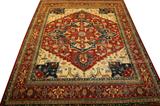 Lot# 43 INDO - SERAPI, WOOL CARPET, MID 20TH C, 12' X 14' 9", having a beige ground with floral designs with a large diamond shape central medallion with dark blue, white and light blue tones and geometric flowers. Six narrow borders flanking a wide orange border all in floral and geometric designs.