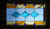 Lot# 72 LEADED STAIN GLASS WINDOW, H 39", W 21", Colors of orange, yellow, blue, green, red & lavender.