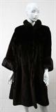 Lot# 131 SHEARED SEAL FUR COAT, full length sheared seal coat with mink trim on cuffs and collar.