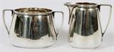 Lot# 136 TIFFANY & COMPANY STERLING SILVER SUGAR & CREAMER, TWO, H 2" - 3", stamped: 'Tiffany & Co. Makers Sterling silver .925-1000' on the underside;
