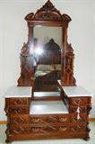 Lot# 145 ANTIQUE AMERICAN MAHOGANY MARBLE DRESSER/MIRROR, H 8", L 56", D 23", Two lower drawers with four upper small drawers. White with grey veining marble. Carved acanthus leaf. Carved upper crest above attached mirror. Burlwood inset panels.