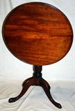 Lot# 149 ANTIQUE QUEEN ANNE STYLE MAHOGANY TILT TOP TABLE, 19TH CENTURY, H 28", DIA 25", round tilt-top with turned pedestal and tripod contoured legs.