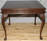 Lot# 156 CHIPPENDALE STYLE CARVED MAHOGANY TABLE, having cabriole legs and ball and claw feet. 30" x 37" L x 37" W.