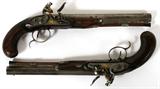 Lot# 182 ENGLISH DUELING PISTOLS, FLINTLOCKS, GOLD INLAY, IN FITTED CASE, C1800, PAIR, L 10" BBL, matching flintlock pistols, having octagonal barrels, .65 cal., engraved side plates, trigger guards, barrel tangs and hammers; gold inlays on side plates, top of barrels at hammer; walnut stocks with checkered grips, hickory ramrods; no manufacturer's or proof marks; silver barrel bands and end caps to front of stock; having a velvet lined mahogany fitted case; BLACK POWDER ANTIQUES, NO FIREARMS PAPERWORK REQUIRED.