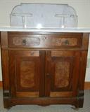 Lot# 237 ANTIQUE AMERICAN MAHOGANY WASHSTAND, H 39", L 30", D 16", White marble with grey veining on casters.