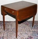 Lot# 240 PEMBROKE STYLE MAHOGANY & SATINWOOD INLAY TABLE, C. 1930, H 27", W 19", L 31", A rectangular top flanked by drop leaves, each 9 3/4" wide, fitted with a single drawer at one side and a faux drawer at the opposite side, raised on square tapering legs. H 27 1/2", W 19", L 31"